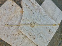 HALO - gold diamanté tennis bracelet with x detail